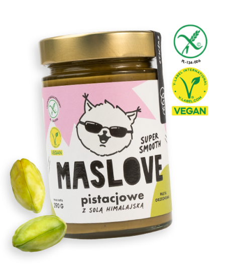 Szklany słoik o pojemności 290 g z masłem pistacjowym z dodatkiem soli himalajskiej od Maslove, o konsystencji super gładkiej. Ozdobione etykietą z nazwą produktu oraz rysunkową wiewiórką w okularach. Produkt objęty certyfikatem wegańskim i bezglutenowym. Przy słoiku widnieje obrazek z orzechem pistacji.
