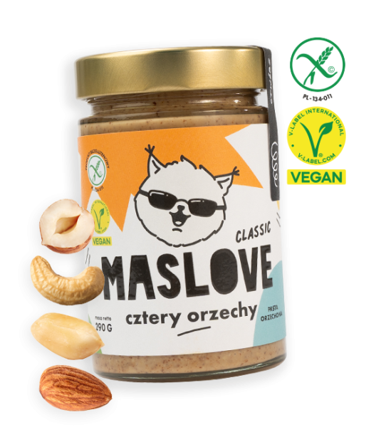 Szklany słoik o pojemności 290 g z masłem z czterech orzechów takich jak: laskowe, migdał, nerkowiec oraz arachid od Maslove, konsystencja klasyczna. Ozdobione etykietą z nazwą produktu oraz rysunkową wiewiórką w okularach. Produkt objęty certyfikatem wegańskim i bezglutenowym. Przy słoiku widnieje obrazek z orzechem laskowym, nerkowcem, migdałem oraz arachidem.