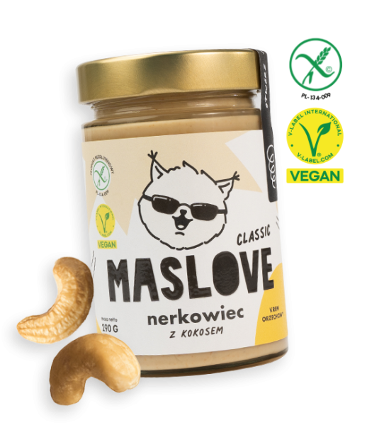 Szklany słoik o pojemności 290 g z masłem z orzechów nerkowca oraz dodatkiem kokosa od Maslove w konsystencji klasycznej. Ozdobione etykietą z nazwą produktu, gramaturą oraz rysunkową wiewiórką w okularach. Produkt objęty certyfikatem wegańskim i bezglutenowym. Przy słoiku widnieje obrazek z orzechami nerkowca.